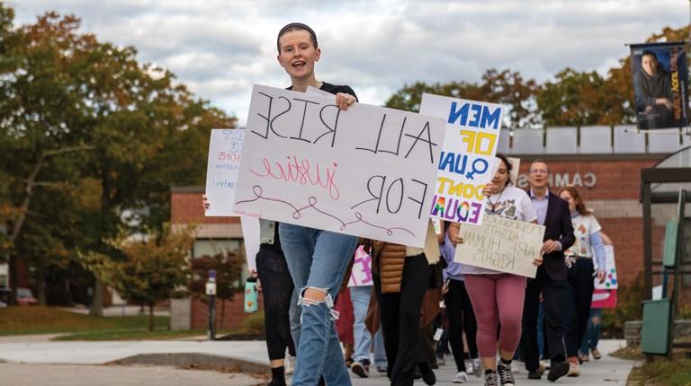 Students and President Herbert at the Women's March in 2021