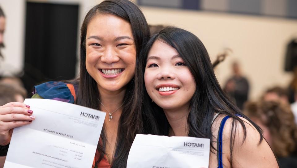 Two female students celebrate their residency matches