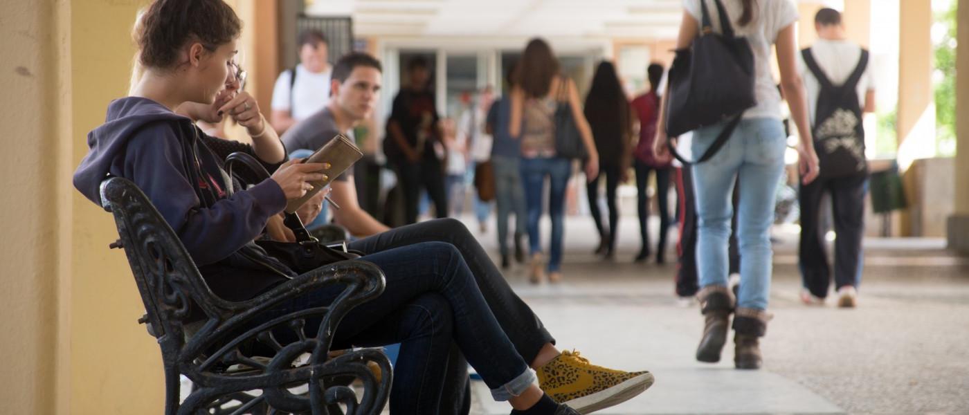 Seated and standing students inside a building on the campus of Universidad Pablo de Olavide in Seville