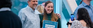 A UNE medical student poses with family on Match Day