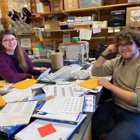 UNE student Brooke Parks sits with MDI Biological Laboratory independent study student, Adam Feher.