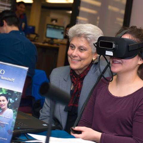 A physician assistant student wears a VR headset 